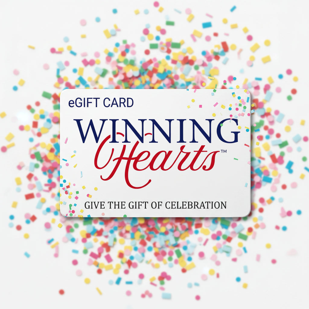 A white eGift card for Winning Hearts, featuring navy blue and red lettering, with colorful confetti scattered around the edges on a white background.
